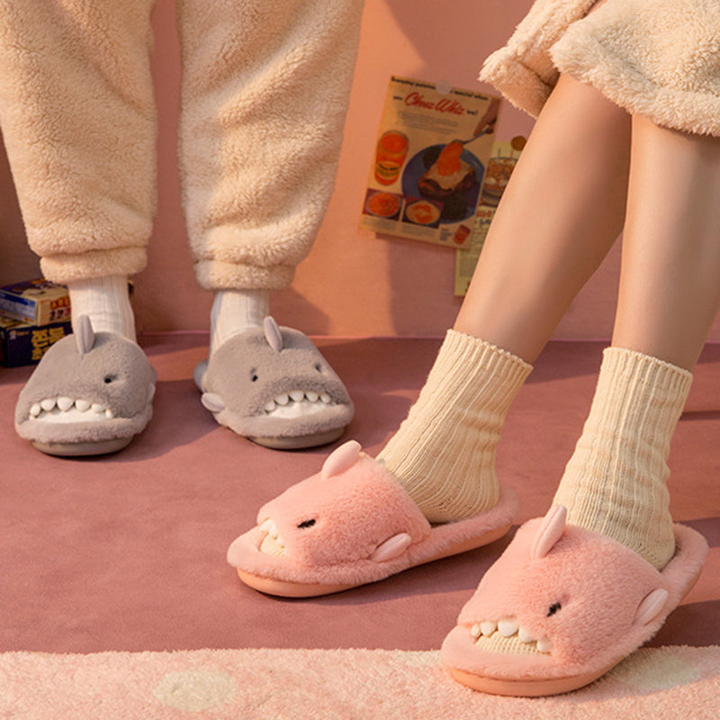 Grey and pink shark slippers worn with cream socks